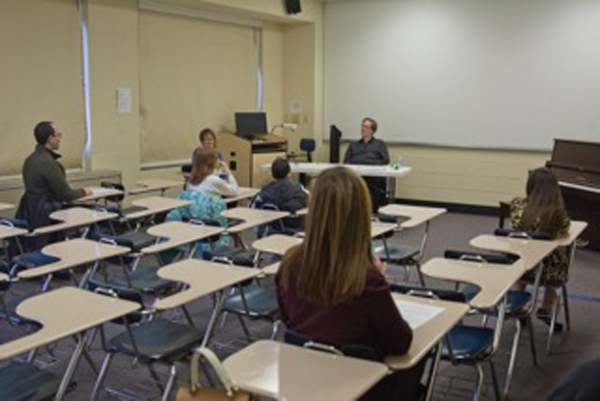 shot from back of classroom looking onto the class